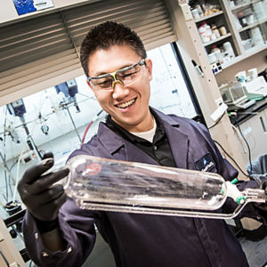 a man holding a bottle