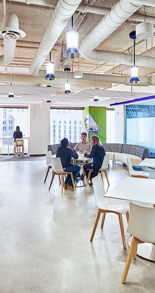 people sitting at tables in a room