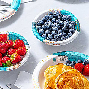 a table with plates of food and a drink