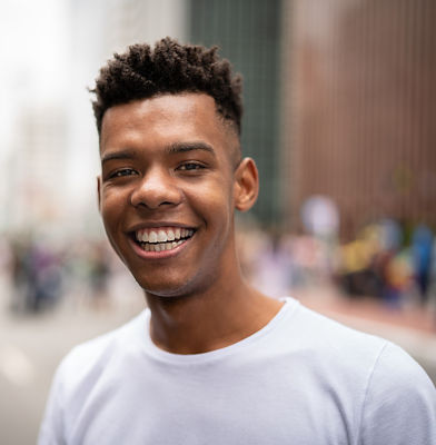 a man smiling at the camera