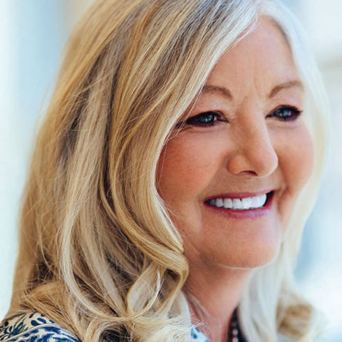 a close-up of a woman smiling