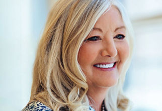 a close-up of a woman smiling