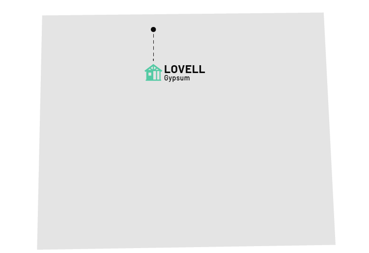 a white rectangular object with a black dot and a green house