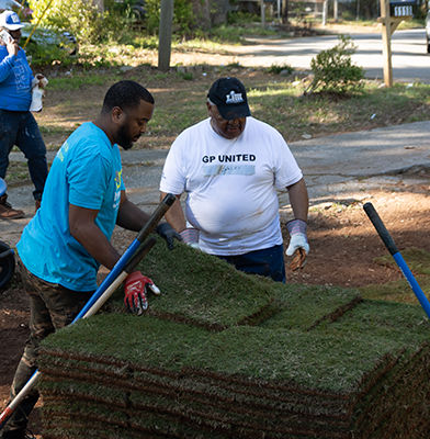 a group of men working on a lawn