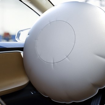 a white inflatable pillow in a car