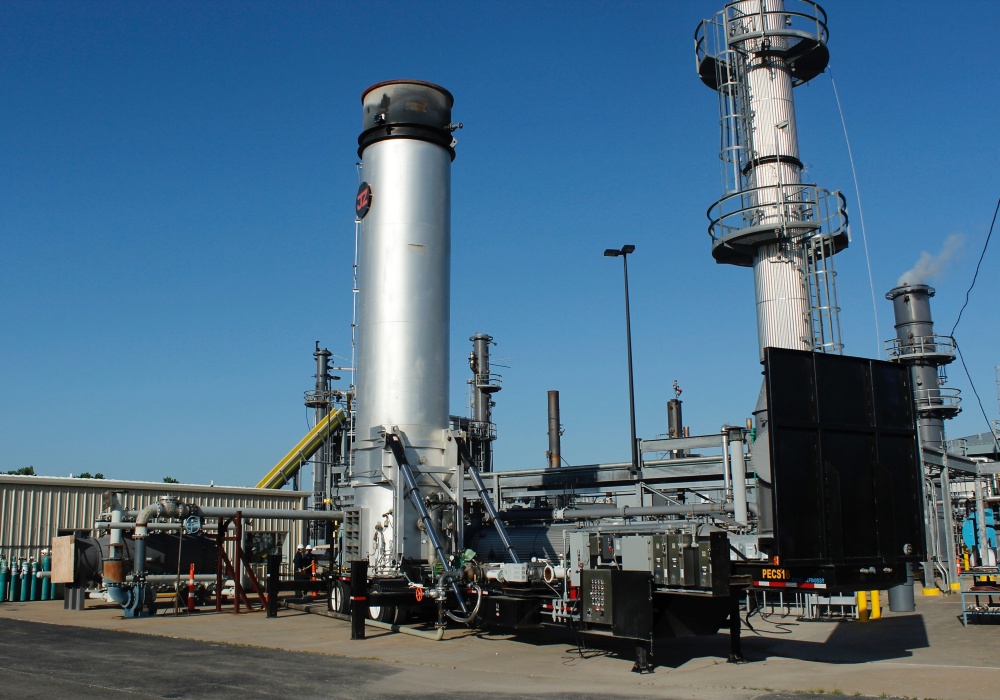 a large industrial plant with a blue sky