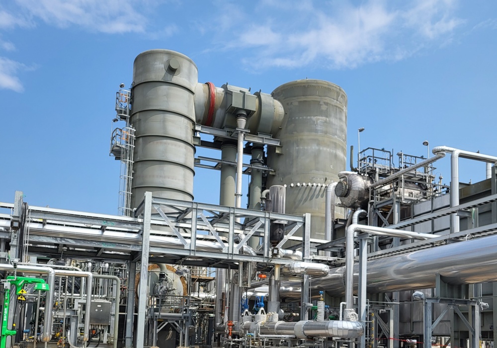 a factory with gravel and pipes