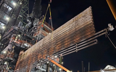a large metal structure with a crane
