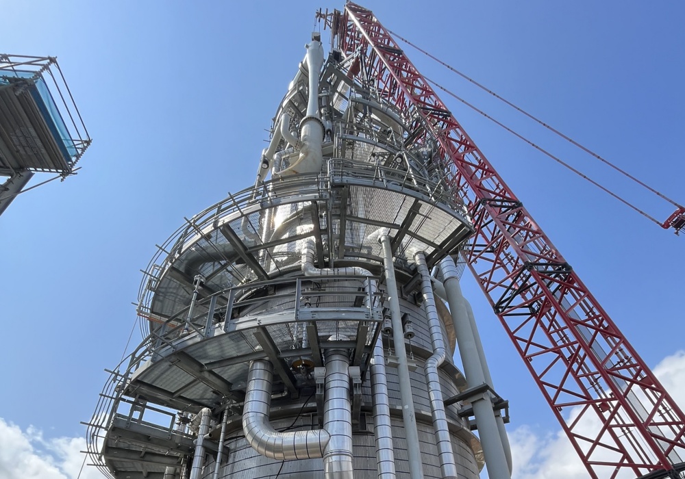 a crane lifting a large tower