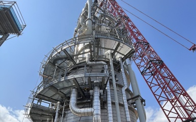 a crane lifting a large tower