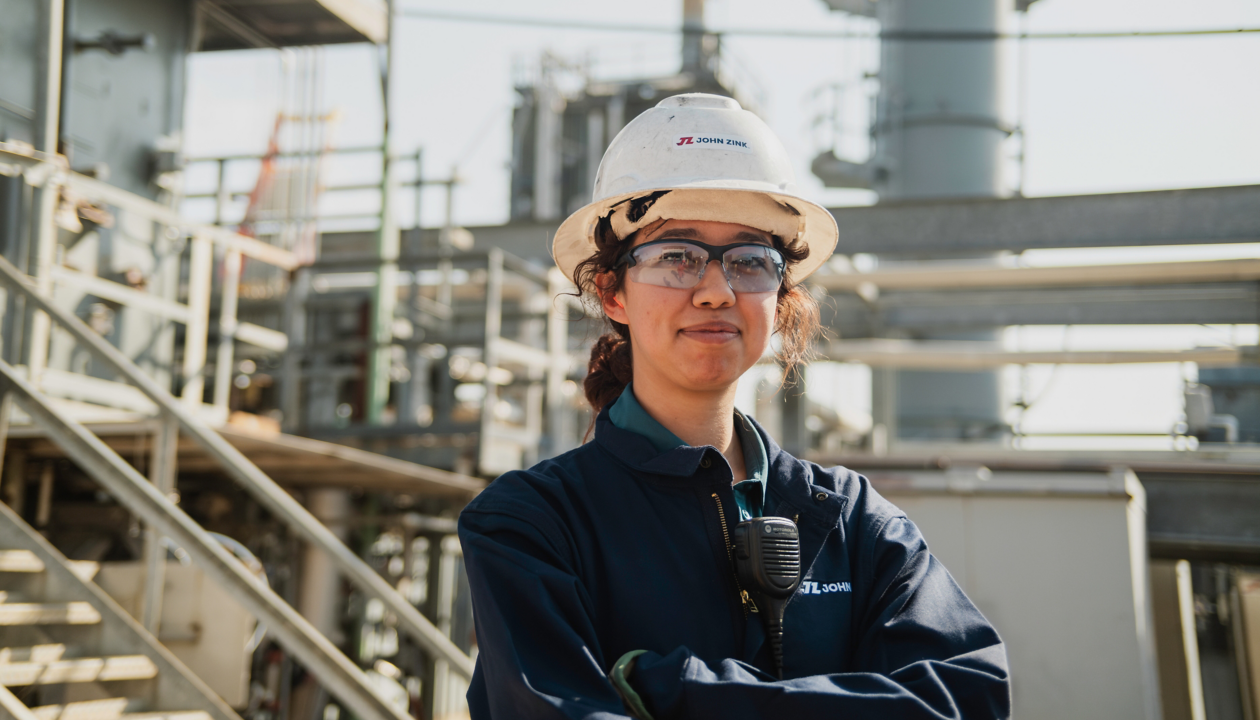 a woman wearing a hard hat and a helmet