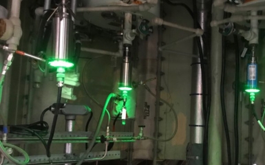 a machine with green lights