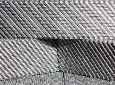 a close-up of a stack of grey and white foam