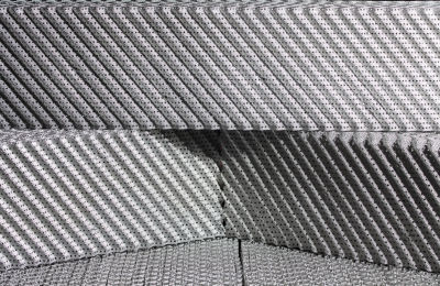 a close-up of a stack of grey carpet