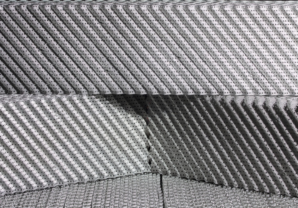 a close-up of a stack of grey carpet