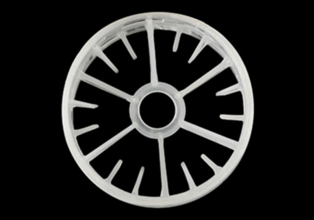 a white plastic wheel with holes