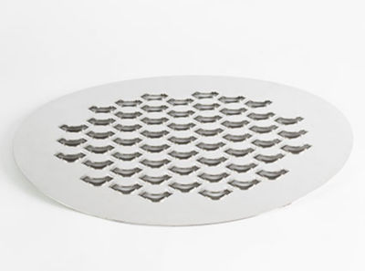 a circular metal drain cover