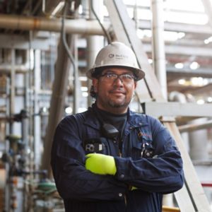a man in a hard hat and gloves