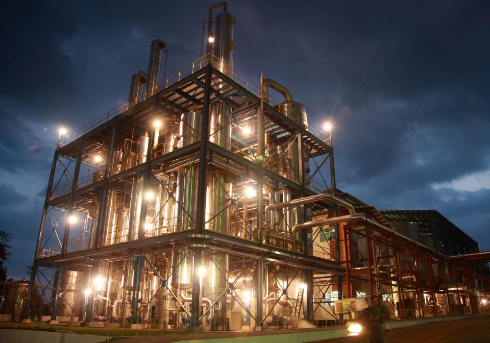 a building with many pipes and lights