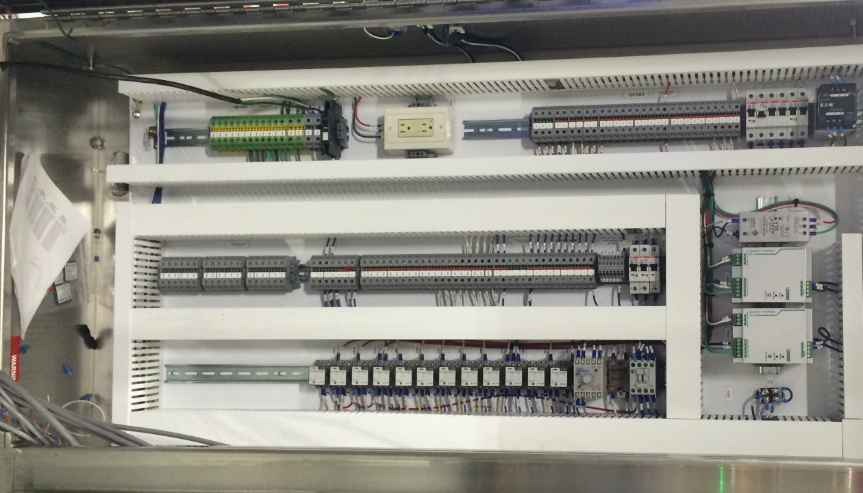 a white cabinet with wires and wires
