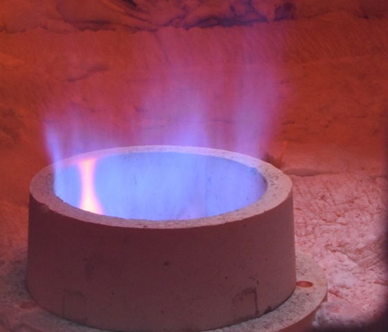 a blue flame in a fire pit