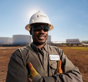 a man wearing a hard hat and sunglasses