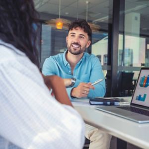 a man and woman sitting at a table
