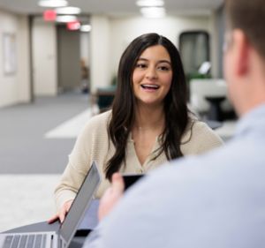 a woman talking to a man