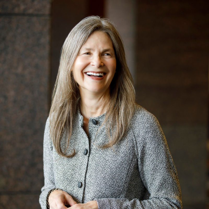 a woman smiling with long hair