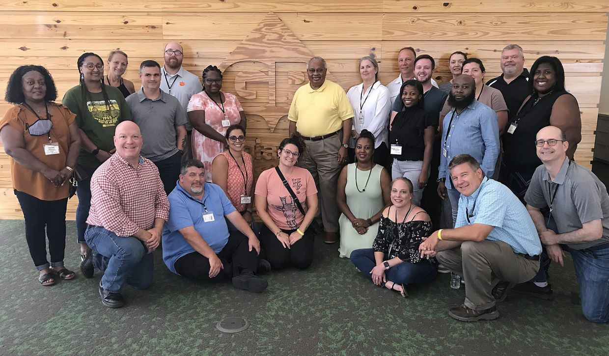 Curley Dossman, president of the GP Foundation with the group of teachers at the 2022 Economic Education Summer Institute in Atlanta