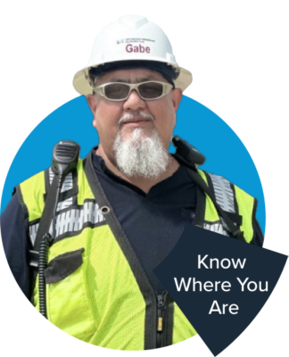 a man wearing a safety vest and a hard hat