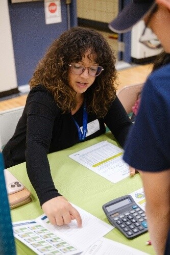 a woman looking at a paper