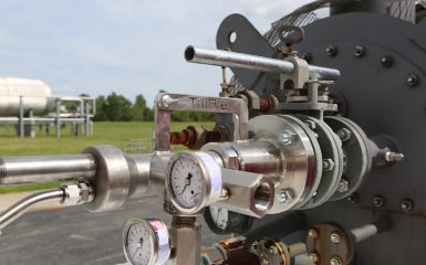 close-up of a machine with gauges and pipes