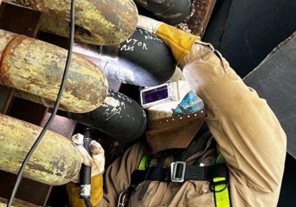 a man in a welding suit