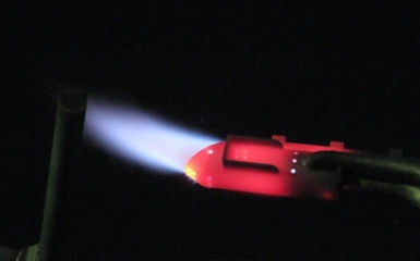 a red light with a blue flame