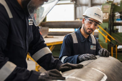 a group of men wearing hard hats and helmets