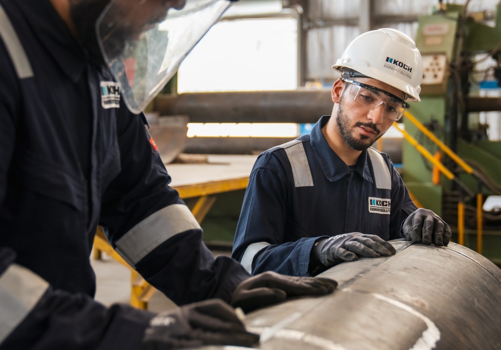 a group of men wearing hard hats and helmets