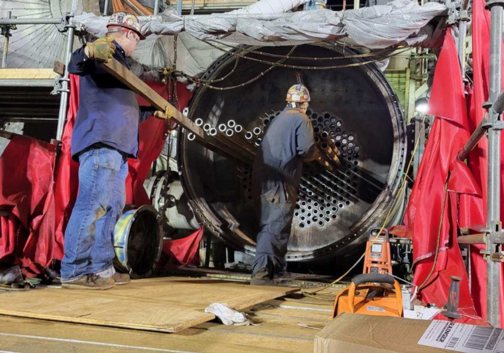 men working on a machine